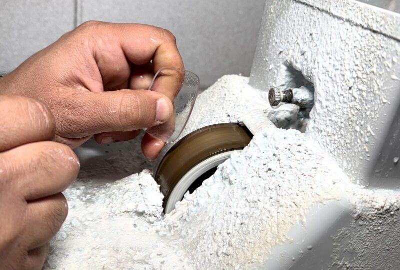 Ophthalmic lens edging process in optical lab showing manufacturing of prescription lenses