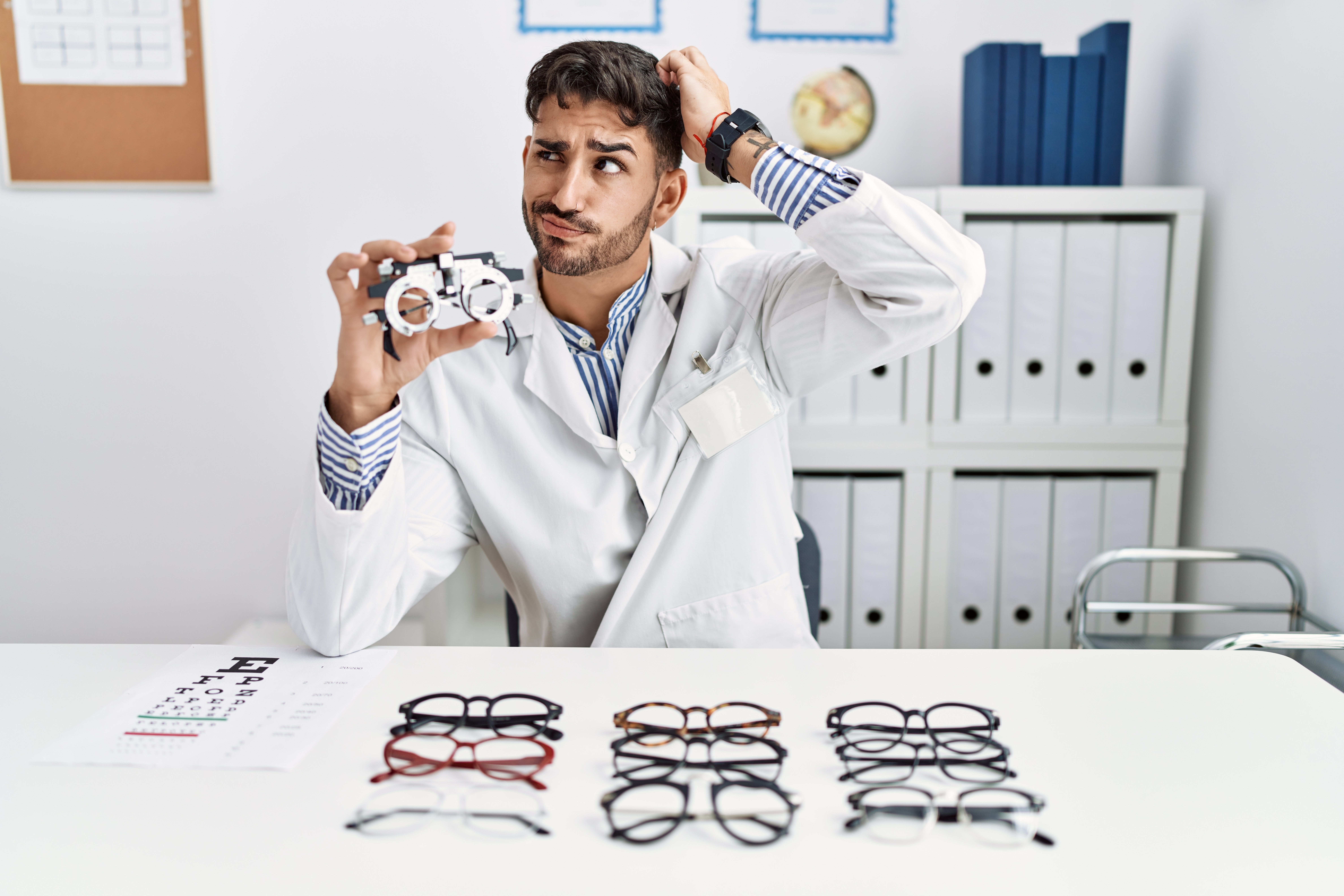 Eye care professional comparing anti-fatigue lenses and progressive lenses for a patient