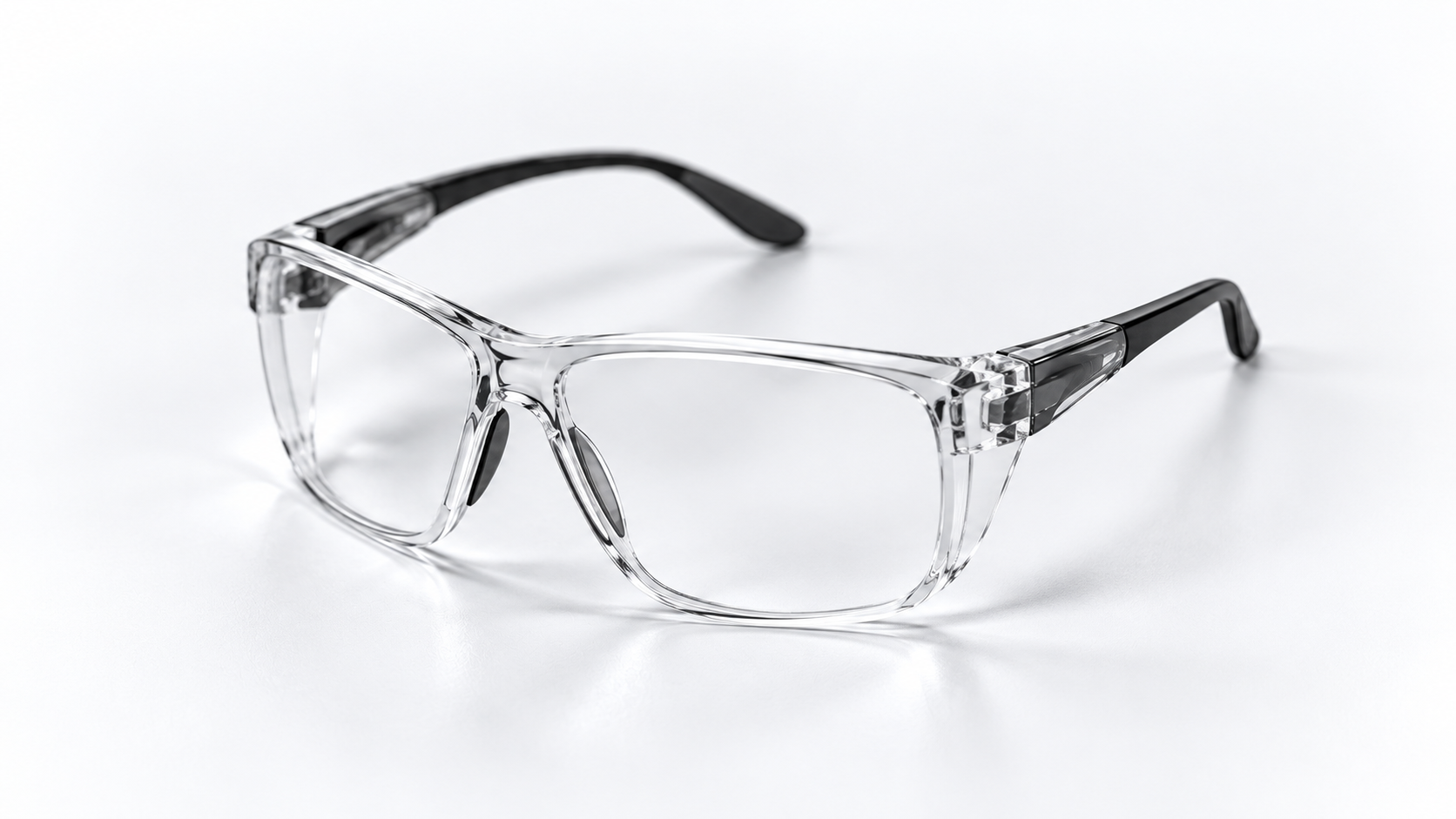 Illustration of clear safety glasses with a transparent frame and black temple arms.