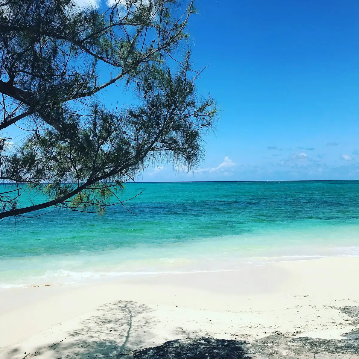 Turquoise water and a white sand beach in Nassau, The Bahamas